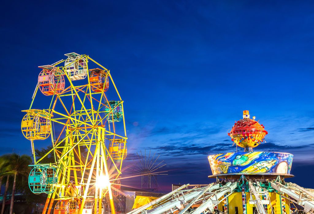 Ferris wheel and children's rides at amusement park